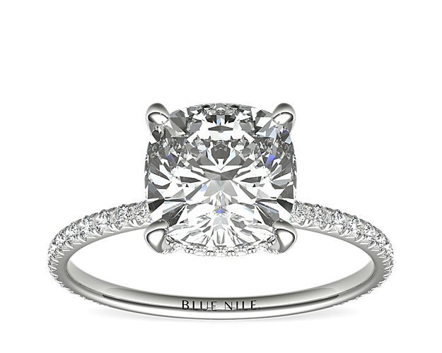 Beautifully crafted, this Blue Nile Studio platinum engagement ring features french pavé-set diamonds encompassing the cushion-cut diamond of your choice.
