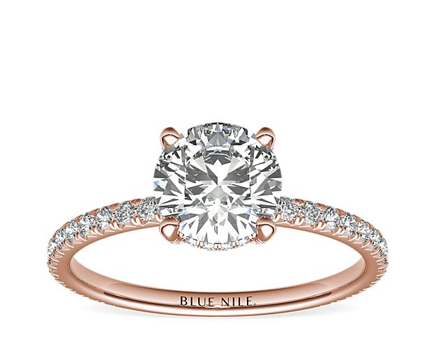 Beautifully crafted, this Blue Nile Studio 18k rose gold engagement ring features french pavé-set diamonds encompassing the center diamond of your choice.