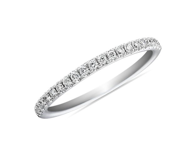 A row of pavé-set sparkling round brilliant diamonds shimmer brightly in this 14k white gold ring she'll treasure as a wedding or anniversary band.