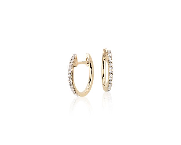 Our petite diamond huggie hoop earrings are so versatile you'll reach for them every day. Crafted in 14k yellow gold, with lines of round brilliant-cut pavé diamonds, these mini hoop earrings offer subtle sparkle and essential style. Diameter of hoop measures 1/2 Inch.