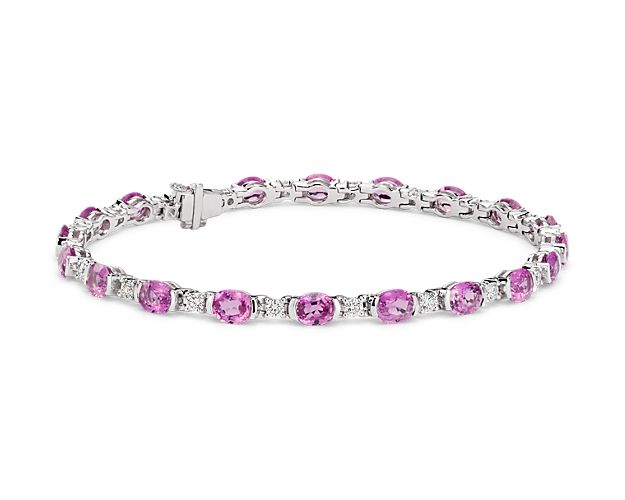 This standout sapphire and diamond bracelet adds a little color to the classic tennis bracelet. Twenty vibrant bezel-set pink sapphires, alternating with round brilliant prong-set diamonds, allows extra light in for more stunning color. A subtle box catch with hidden safety secures the bracelet.