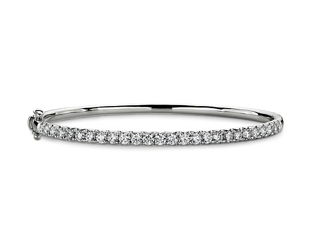 Top off any look with this beautiful diamond bangle, showcasing French pavé-set round diamonds set in 14k white gold.