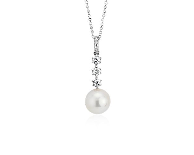 Three floating diamonds are a beautiful complement to a lustrous freshwater cultured pearl in this charming 18k white gold pendant. For added versatility, this pendant may be worn at 16 or 18-inches in length.