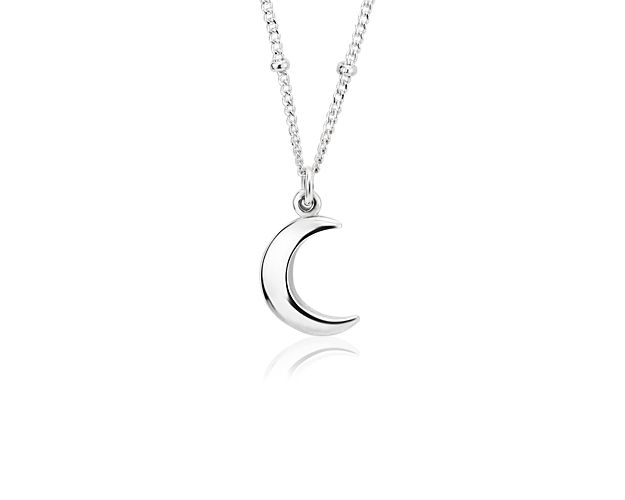 A petite crescent moon presides upon this sterling silver pendant necklace. The matching cable chain can be worn at 16 or 18 inches.
