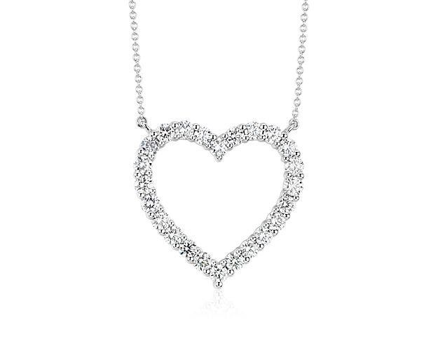Twenty-four brilliant round diamonds, prong-set in platinum, form the shape of a heart. This radiant, romantic piece is suspended from a 19 inch platinum cable link chain with a lobster claw clasp.