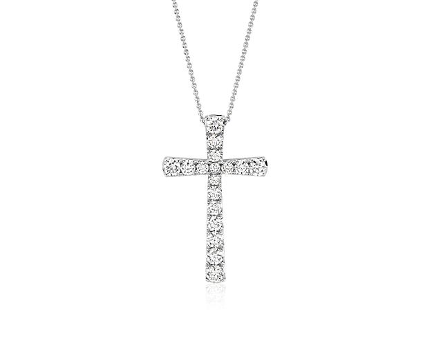 Seventeen brilliant pavé-set round diamonds make up this beautiful cross pendant crafted in 14k white gold.
