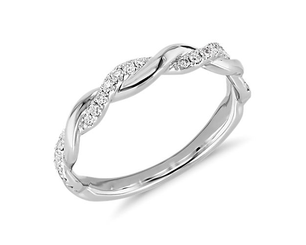 This twist diamond ring from Truly Zac Posen is crafted in bright 14k white gold. Petite pavé-set diamonds accent the graceful, intertwined curves of this elegant wedding or anniversary ring.