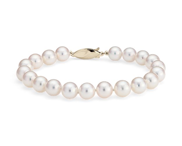 Our lustrous 8" Akoya cultured pearl bracelet is strung with a hand-knotted silk blend cord and secured with an 18k yellow gold safety clasp.