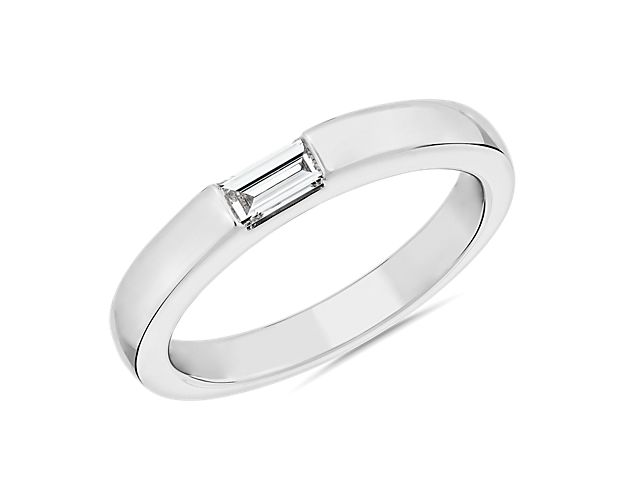 This Zac Posen ring channels timeless allure with gleaming platinum design and sleek lines. A single baguette-cut diamond shimmers from a streamlined east-west setting.