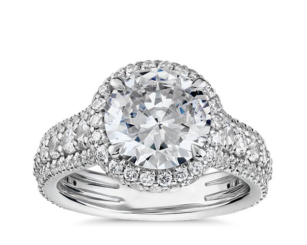 Fall in love every time you look at your finger with the captivating brilliance of this Blue Nile Studio engagement ring. Crafted in enduring platinum, this rollover-style halo setting features row after row of pavé-set round brilliant-cut diamonds to perfectly showcase your choice of center diamond.