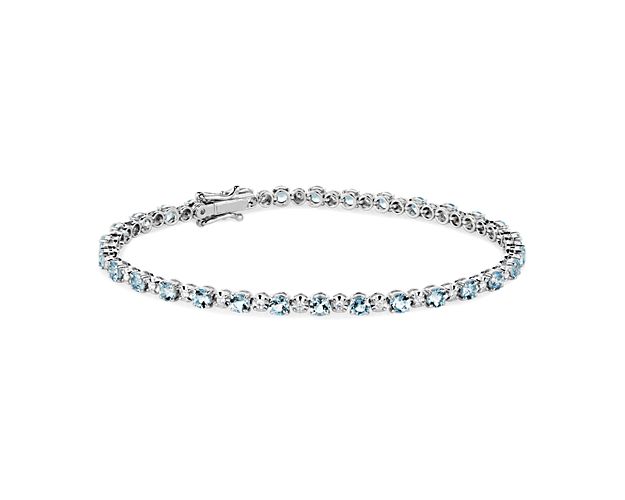 Adorn your wrist with captivating shimmer when you wear this bracelet featuring beautifully blue aquamarines alternating with brilliant diamonds. The 14k white gold design is subtle and delicate for a look of timeless sophistication.