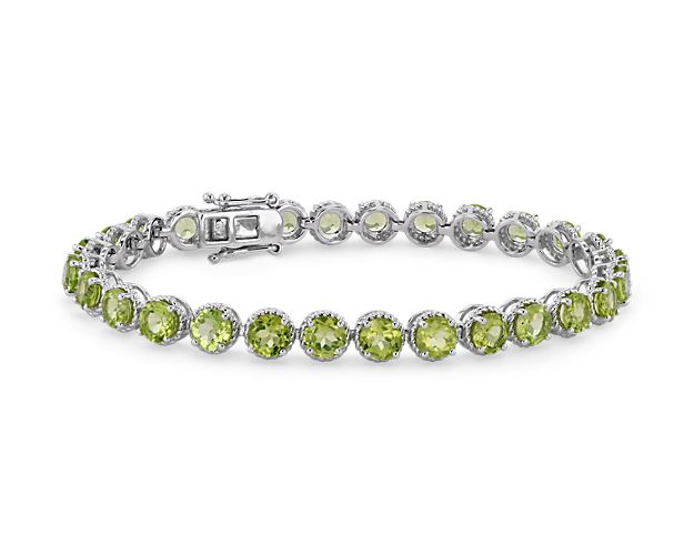 Brightly hued, this peridot bracelet is crafted in sterling silver and features twenty-eight round peridot gemstones in a flexible single line design.