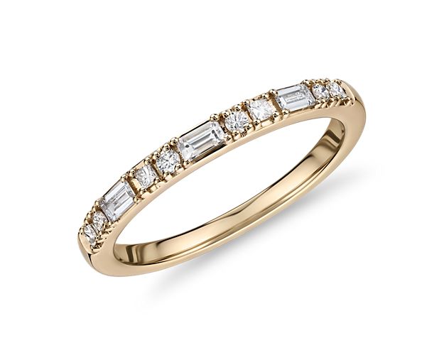 A variety of diamond shapes - princess round, and baguette cuts - give this 14k yellow gold dot dash anniversary ring a distinct design and incredible luster. A perfect match with stock number 73607.