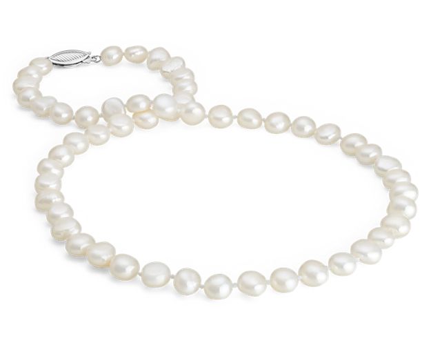 This fashionable pearl necklace features baroque freshwater cultured pearls strung securely on a hand-knotted silk cord. This necklace is secured with a sterling silver safety clasp.