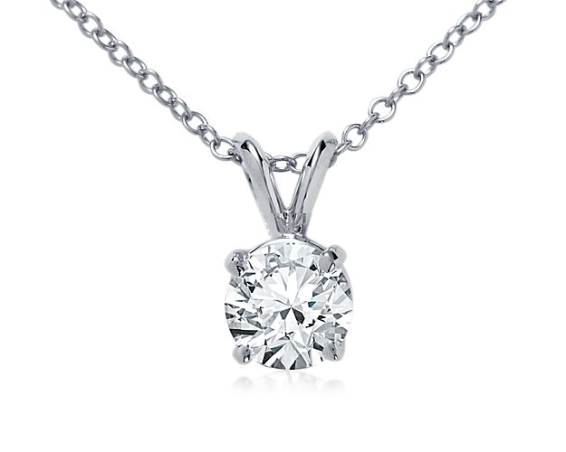 An elegant platinum, four-prong setting highlights the brilliance of your choice of diamonds. Pendant is suspended on a double-bail from a platinum cable chain.