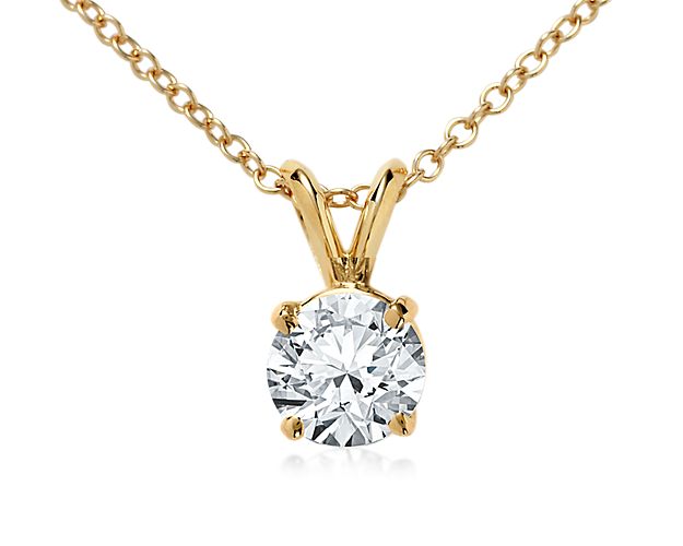 An elegant 18k gold, four-prong setting makes a classic complement to your choice of diamond. The pendant is suspended on a double-bail from a delicate 18k gold adjustable cable chain 16-18inches in length.