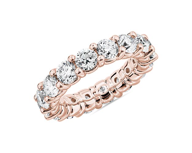 Express enduring romance with this breath-taking eternity ring featuring an endless circle made up of 5 ct. tw. of round-cut diamonds. The beautifully crafted 18k rose gold design gives it a warm gleam that gorgeously compliments the stones.