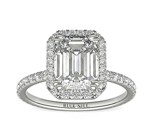 Handcrafted and made to order, this Blue Nile Studio platinum engagement ring features a french pavé-set diamond halo that encompasses the emerald-cut center diamond of your choice.